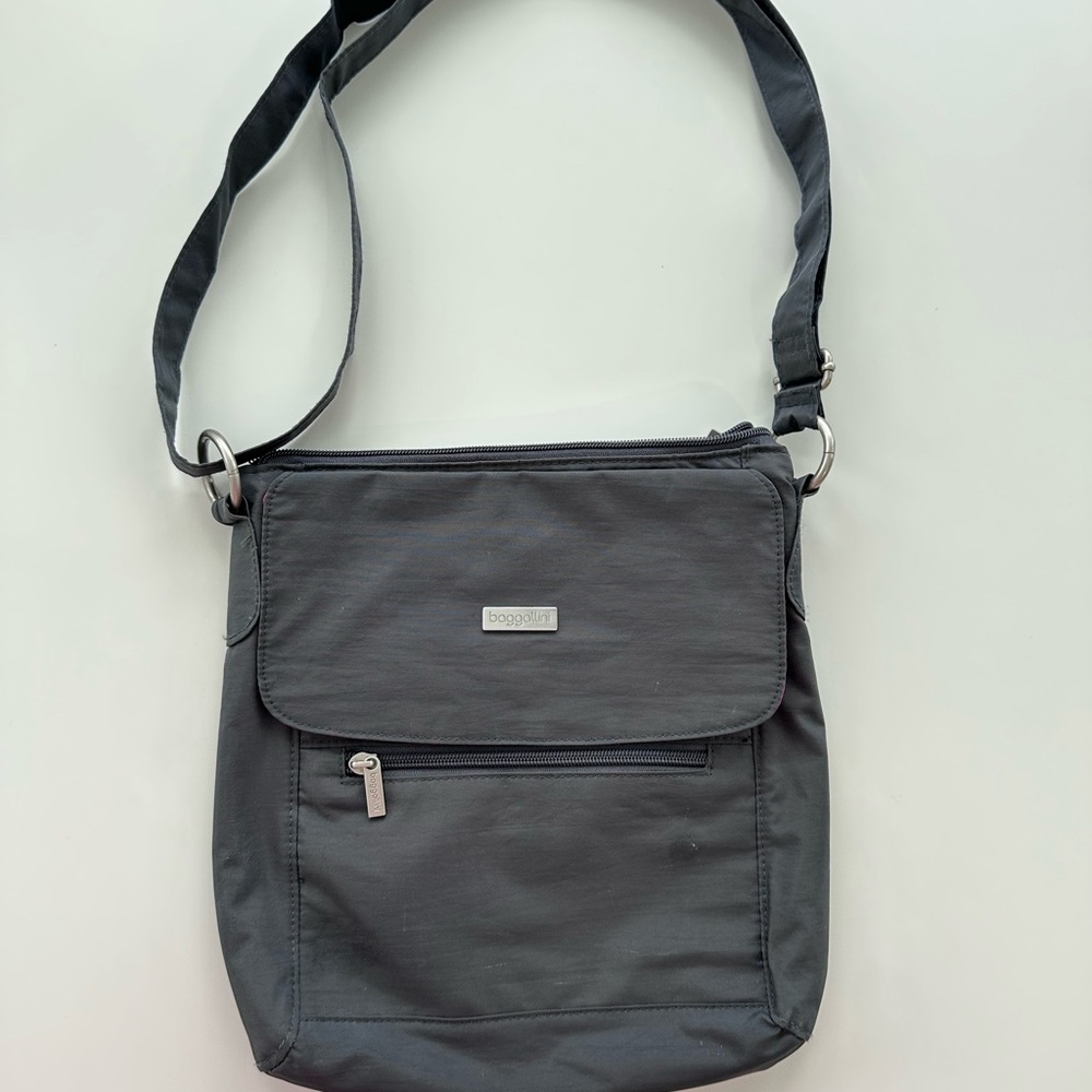 Women’s Baggallini Charcoal Crossbody Bag With Bright Pink Lining.